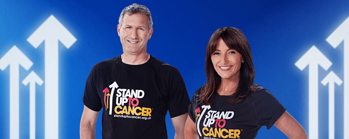 Image of Davina McCall and Adam Hills in SU2C t-shirts.